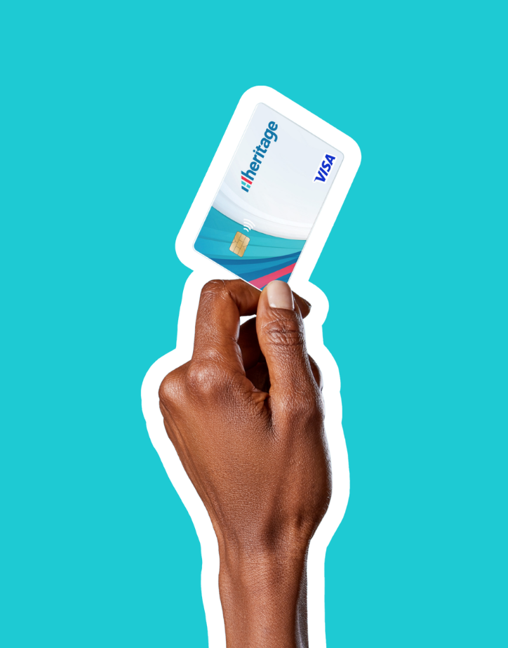 Man holds classic Heritage debit card.