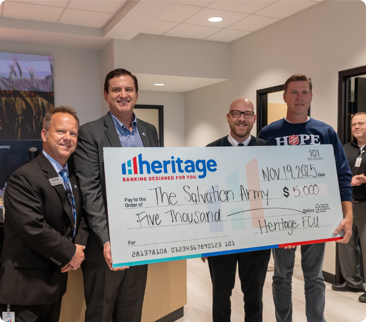Heritage presents the Salvation Army of Jeffersonville with $5,000 donation.