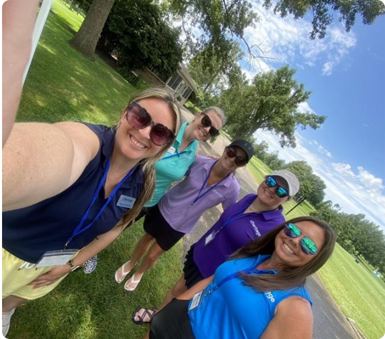Tayylor Humphrey, Community Engagement Manager, selfies with members at the Heritage team at a golf scramble.