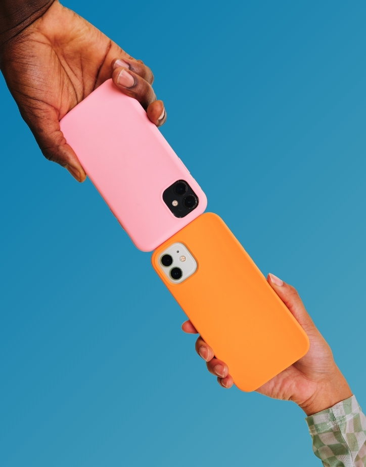Two people holding phones